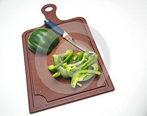 Green pepper fruit lies on the cutting Board