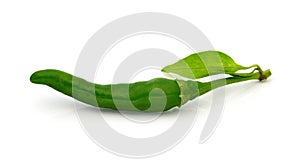 Green pepper with leaf on a white (Thai pepper)