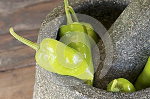 Green pepper in mortar