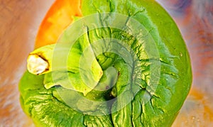 Green pepper in the process of rotting