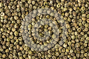 Green peppercorn seeds spice as a background, natural seasoning