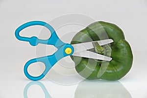 Green peppers with scissor