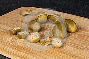 Green pickled caper on grey stone photo