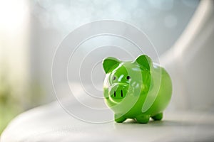 Green piggy bank saving, accounting, banking and business account or sustainable and environmentally friendly finance