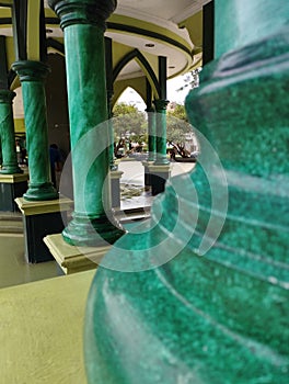 the green pillar of a mosque
