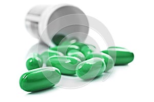 Green pills an pill bottle
