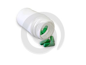 Green pills and pill bottle