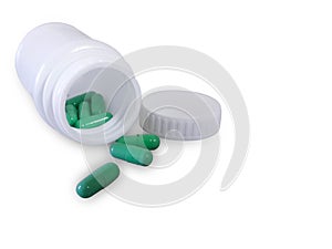 Green pills and pill bottle