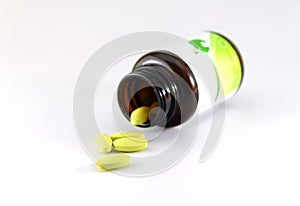 Green pills an pill bottle