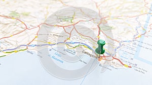 A green pin stuck in Cartagena on a map of Spain photo