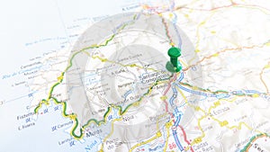 A green pin stuck in Santiago de Compostela on a map of Spain