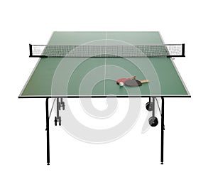 Green ping pong table with rackets and ball on white