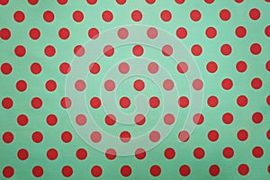 Green with pink polka dot pattern background