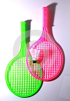 Green and pink toy racket with shuttlecock ball