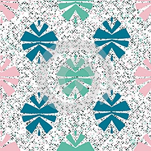 Green and pink tribal abstract seamless pattern on textured background.