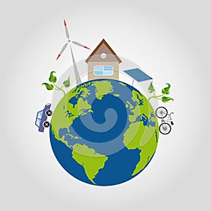 On a green planet earth with blue oceans is a comfortable house and alternative sources of energy, windmill, solar battery, the ca