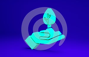 Green Plant in hand of environmental protection icon isolated on blue background. Seed and seedling. Planting sapling