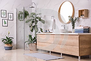Green plants in elegant bathroom. Interior design