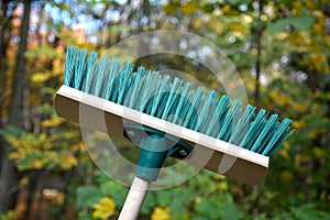 Green plastic broom