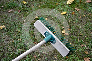 Green plastic broom