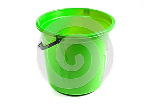 Green plastic bucket isolated on white background