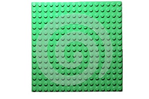 Green plastic constructor blocks plate seamless pattern flat design