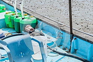 Green plastic containers of marine fuel