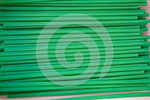 Green plastic drinking straw