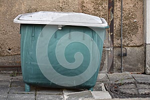 Green plastic dumpster at old abandoned Tempelhofer Feld in Tempelhof Berlin Germany