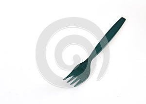 Green plastic forks on white