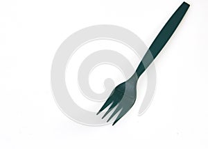 Green plastic forks on white