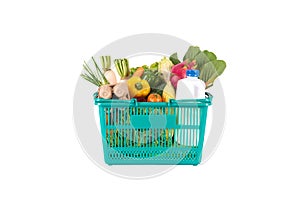 Green plastic grocery basket full of healthy vegetables and fruits,  ingredients isolated on white background