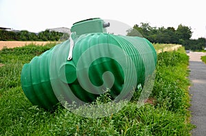 Green plastic retention tank, rainwater tank with round neck and honeycomb ribbing. rainwater is purified, sedimented and stored,