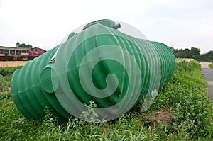 Green plastic retention tank, rainwater tank with round neck and honeycomb ribbing. rainwater is purified, sedimented and stored,