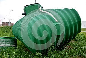 Green plastic retention tank, rainwater tank with round neck and honeycomb ribbing. rainwater is purified, sedimented and stored,