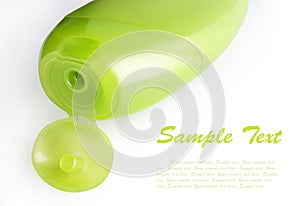 Green plastic shampoo bottle