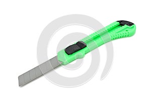 Green plastic utility knife, isolated