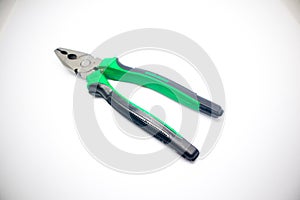 Green pliers isolated white background