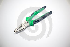 Green pliers isolated white background