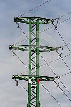 A green pole with a power distribution