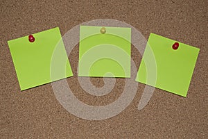 Green Post it Notes on a Cork Board