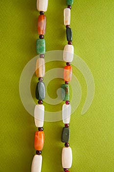 Green postcard with beads and shells