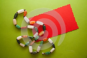 Green postcard with beads and shells