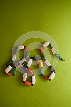 Green postcard with beads and shells