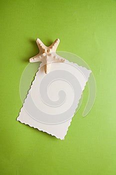 Green postcard with beads and shells