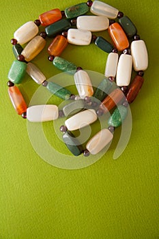 Green postcard with beads and shells