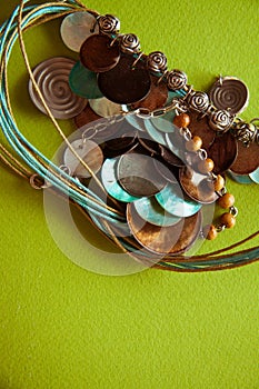 Green postcard with beads and shells