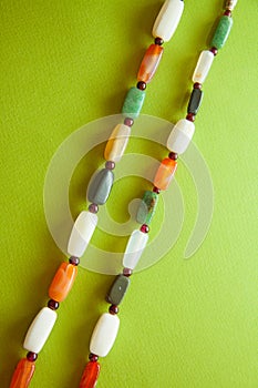 Green postcard with beads and shells