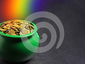 Green Pot Full of Golden Coins on a Dark Black Table