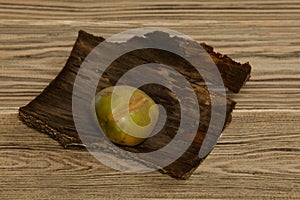 Green potato on a wooden background. Horizontal orientation.  Copy space